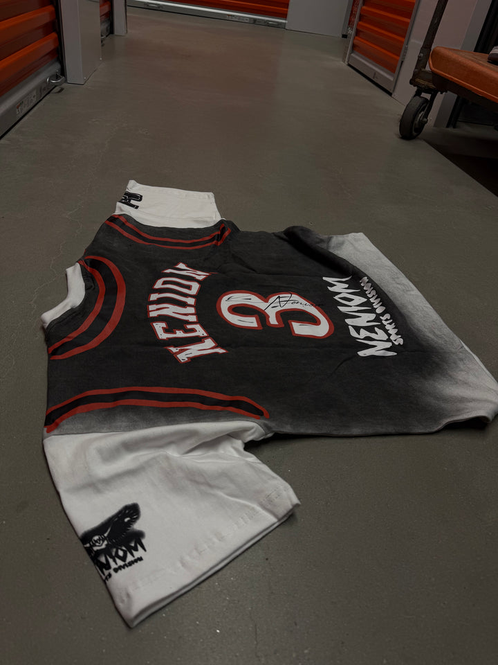Basketball jersey with visible branding on a dark surface