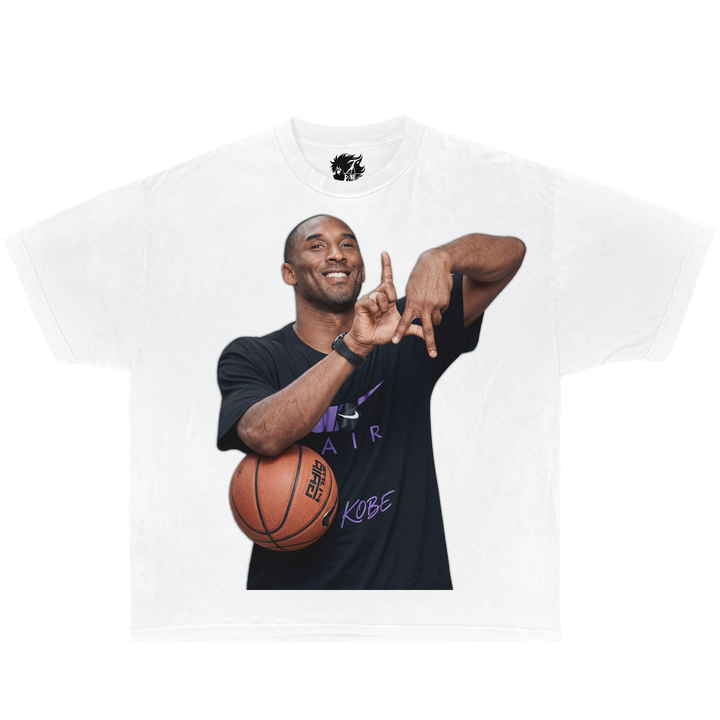 Person wearing a black t-shirt with a graphic of a famous basketball player, holding a basketball. kobe bryant LA fingers