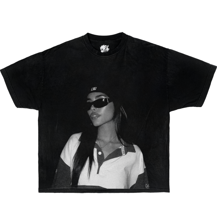 Black t-shirt with a printed design of a person wearing sunglasses and a cap on a white background. Madison Beer Vintage Oversized Boxy Shirt