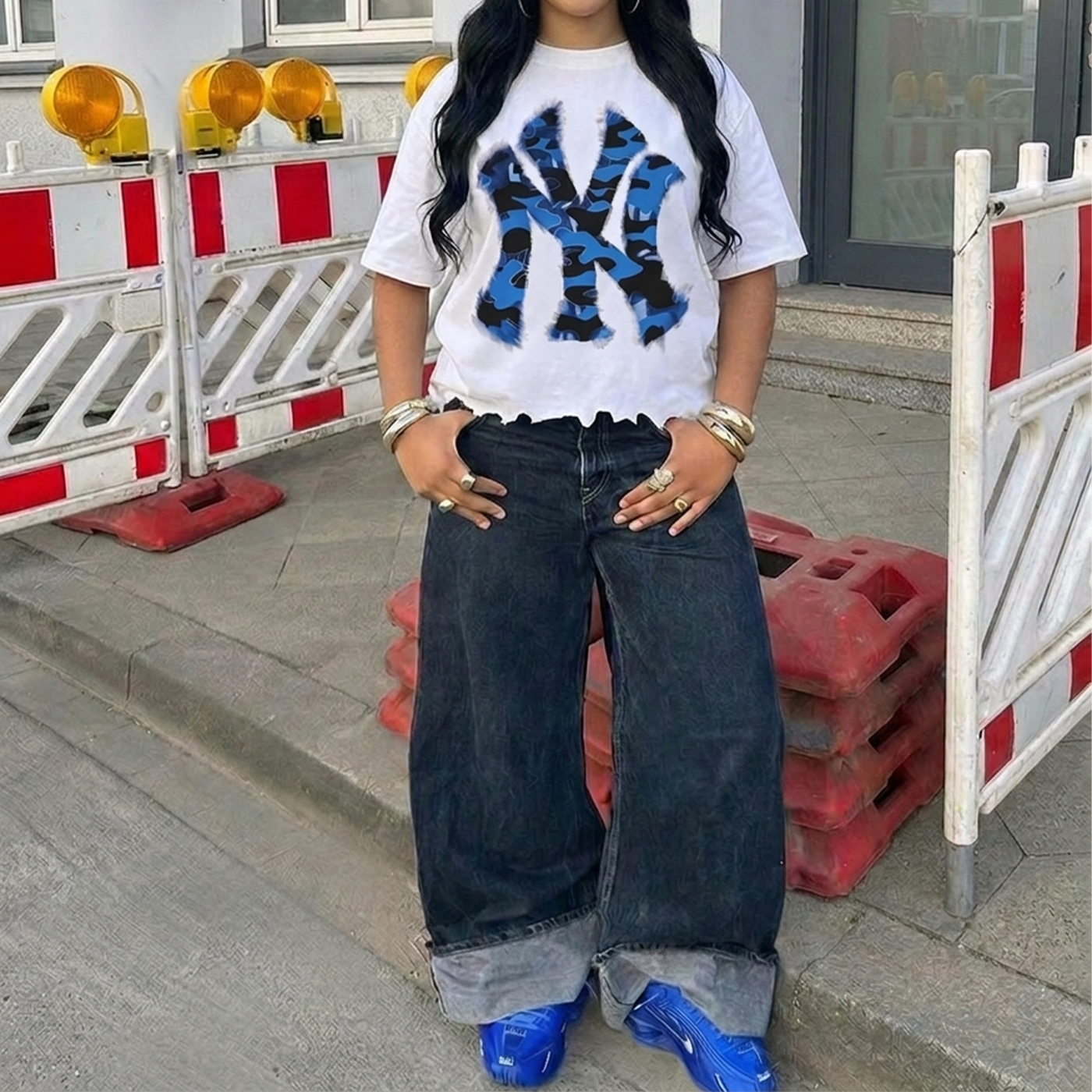 Shirt: Neniom oversized white T-shirt with a destroyed NYC inked blue camouflage graphic.