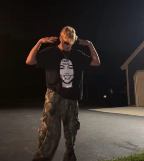 Unisex heavy cotton black t-shirt with bold urban FREE THUG text and portrait graphic