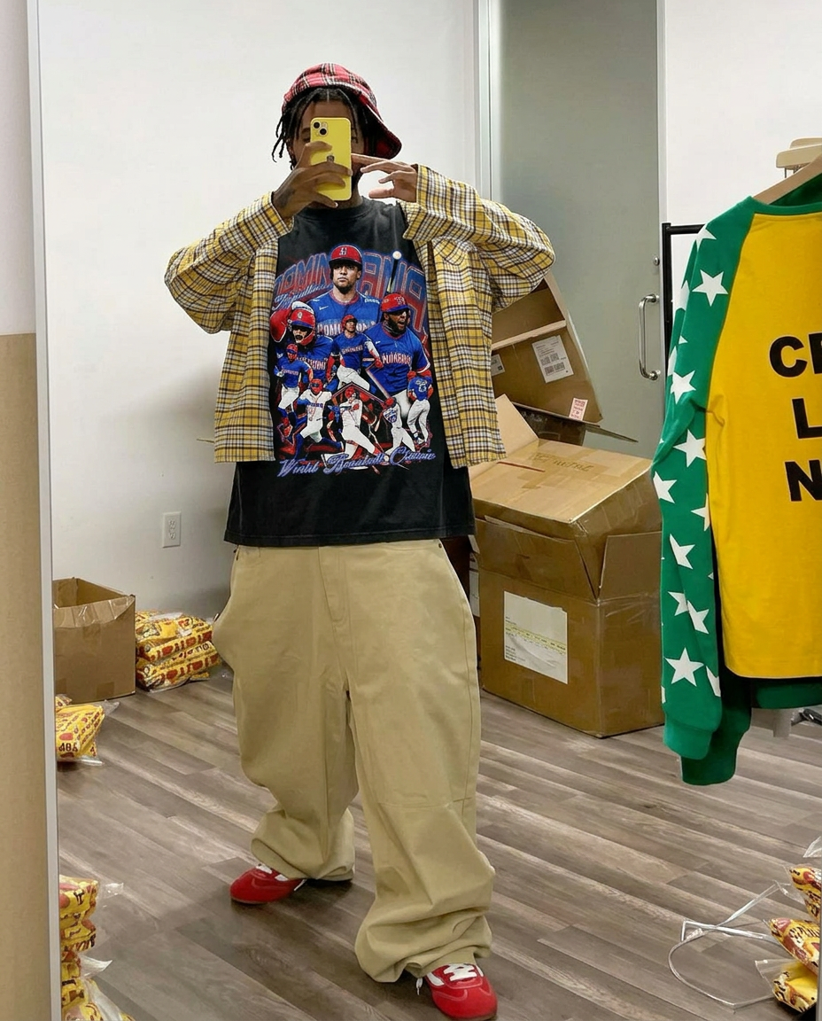 Dominican Dynasty vintage baseball tee, black oversized graphic T-shirt by Neniom, worn under a yellow plaid outer shirt